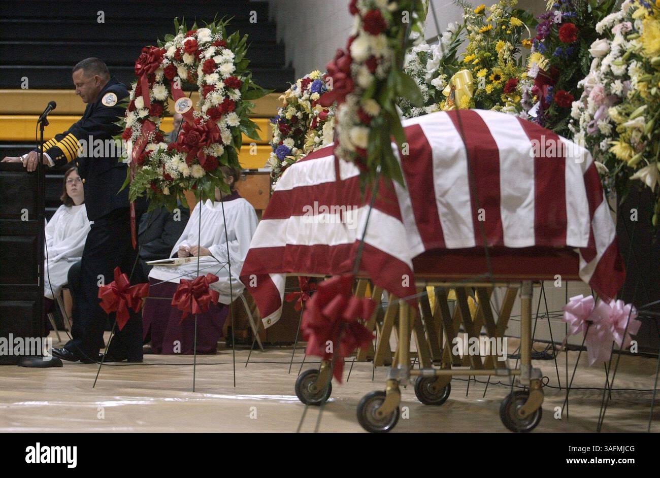 Photo 2 of 3. Fire chief Anthony Lopinto pauses for the honor guard