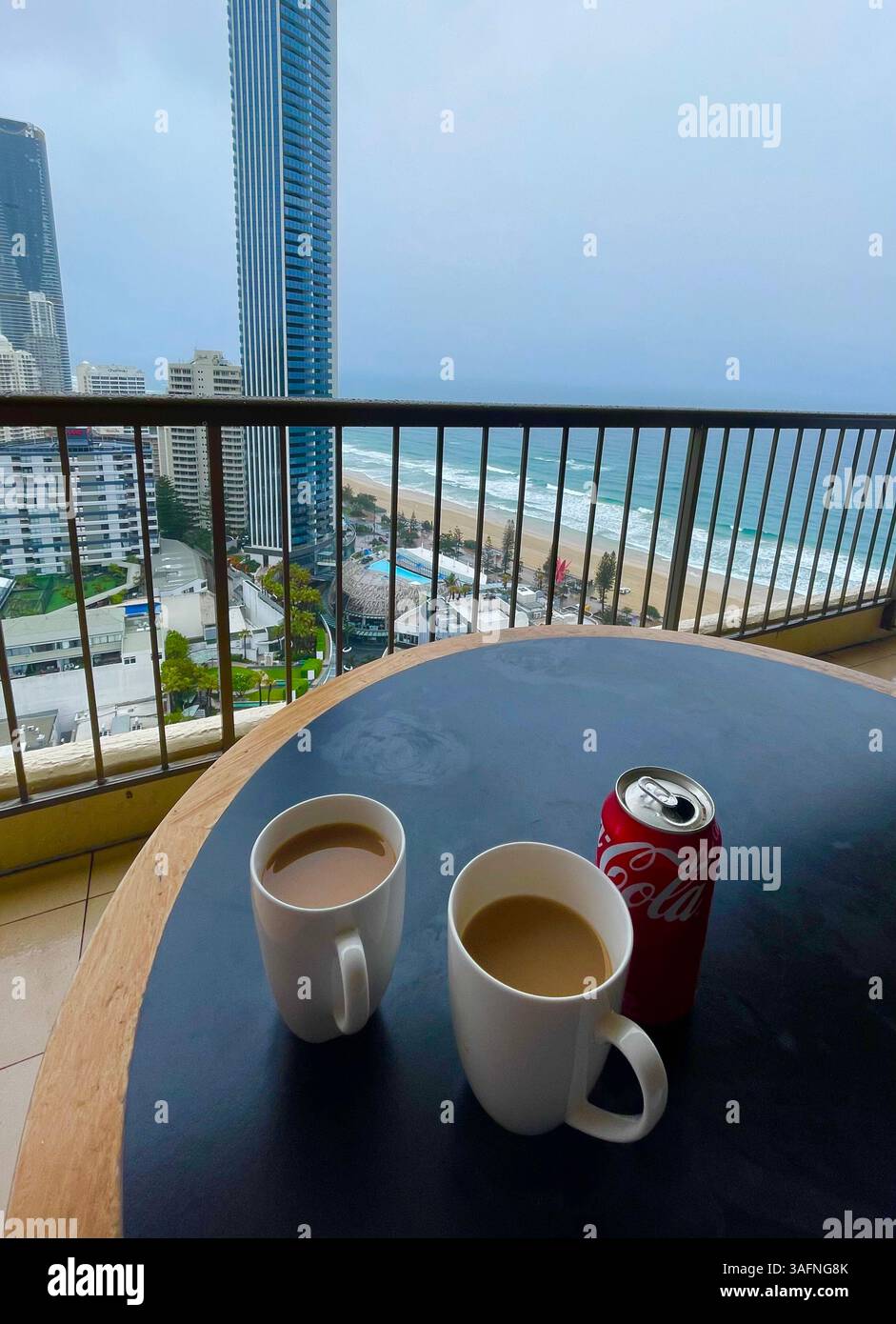 Having a drink on the balcony of a high-rise apartment overlooking Surfers Paradise on Australia's Gold Coast, Queensland - Smartphone Captured Stock Image Having a drink on the balcony of a high-rise apartment overlooking Surfers Paradise on Australia's Gold Coast, Queensland - Smartphone Captured Stock Image