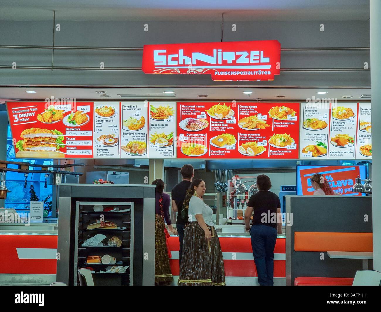 Schnitzel Fleischspezialitäten restaurant in food court in Bratislava, Slovakia; meat specialities; menu board, menu displays - Smartphone Captured Stock Image