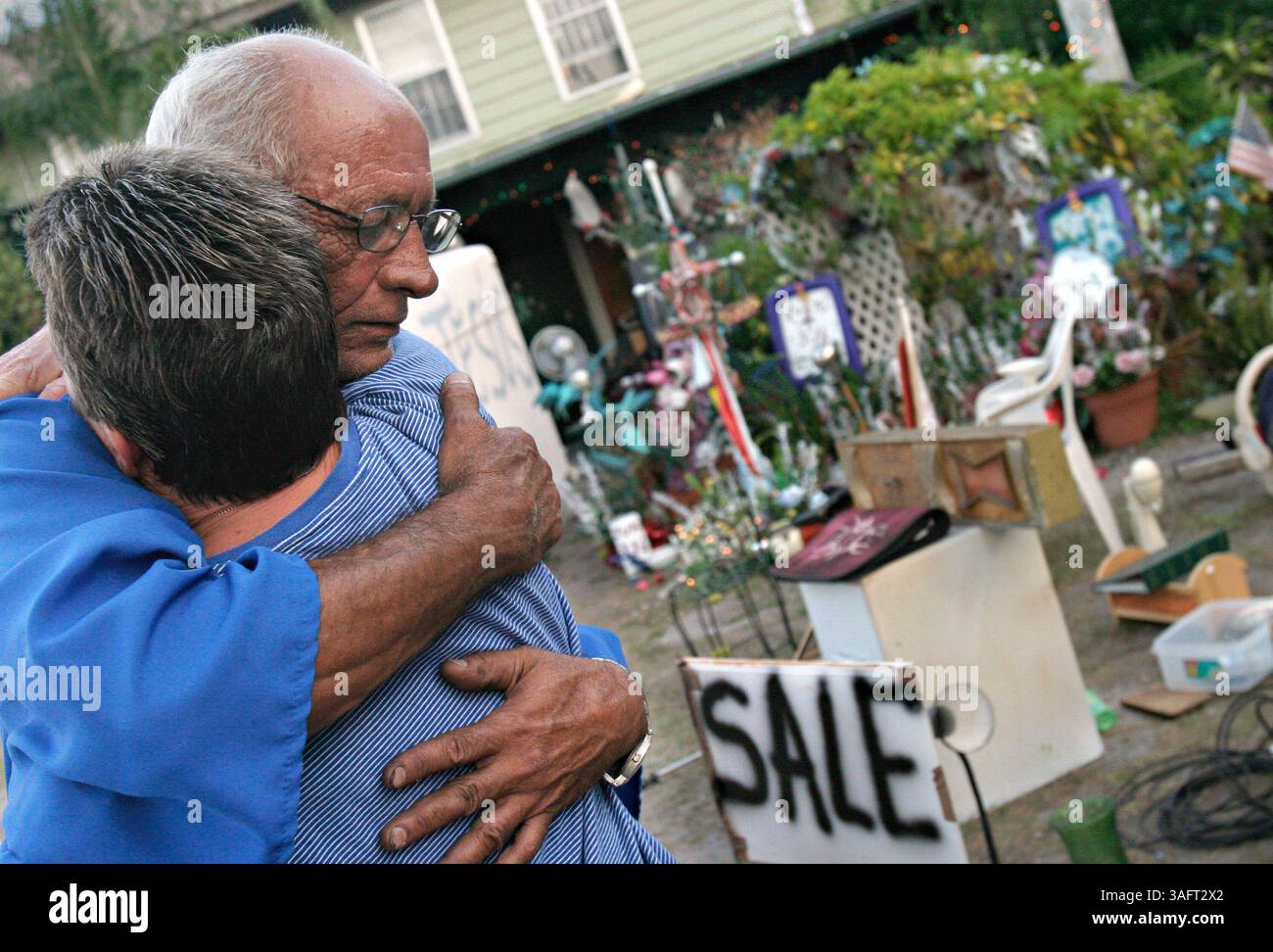 1 of 1.20060531 - TAMPA - Rogelio Sanchez hugs his neighbor and close friend Lana Gonzalez (Credit Image: St Petersburg Times/ZUMAPRESS.com) Stock Photo