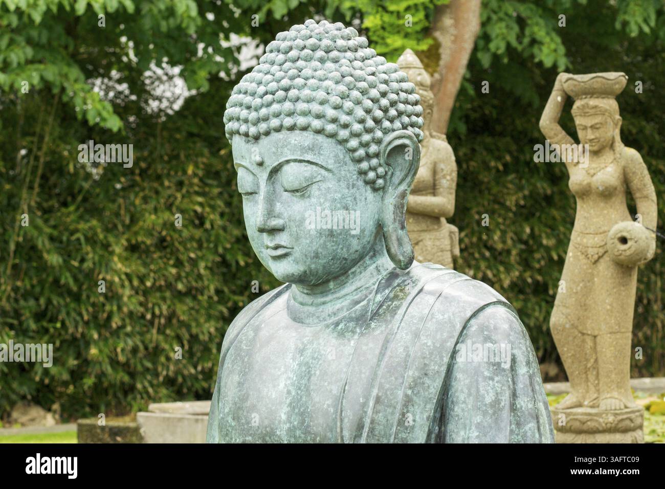 Buddha statue in a very beautiful park Stock Photo - Alamy