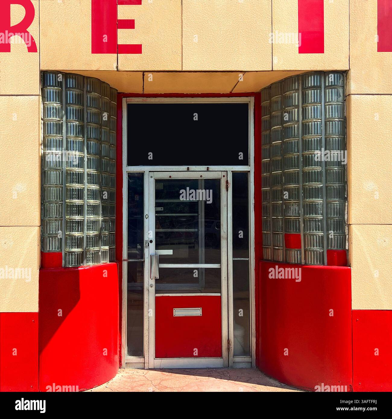 A vibrant Streamline Moderne bowling alley facade in Chicago captures the sleek lines and bold design of mid-20th century architecture - Smartphone Captured Stock Image