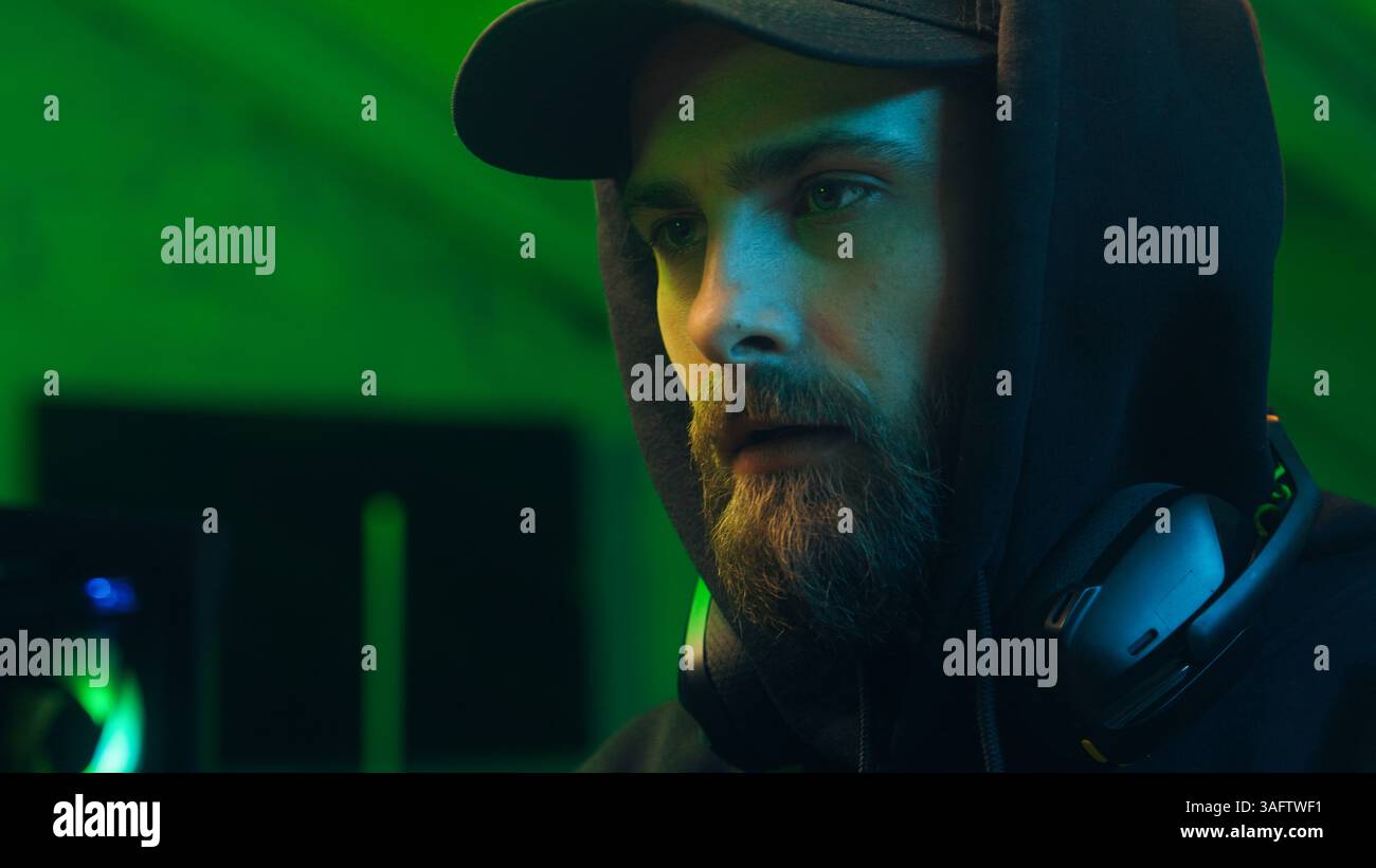 Programmer man keyboard computer typing hacker internet networking online professional software cyber tech security pc web coding browsing gaming Stock Photo