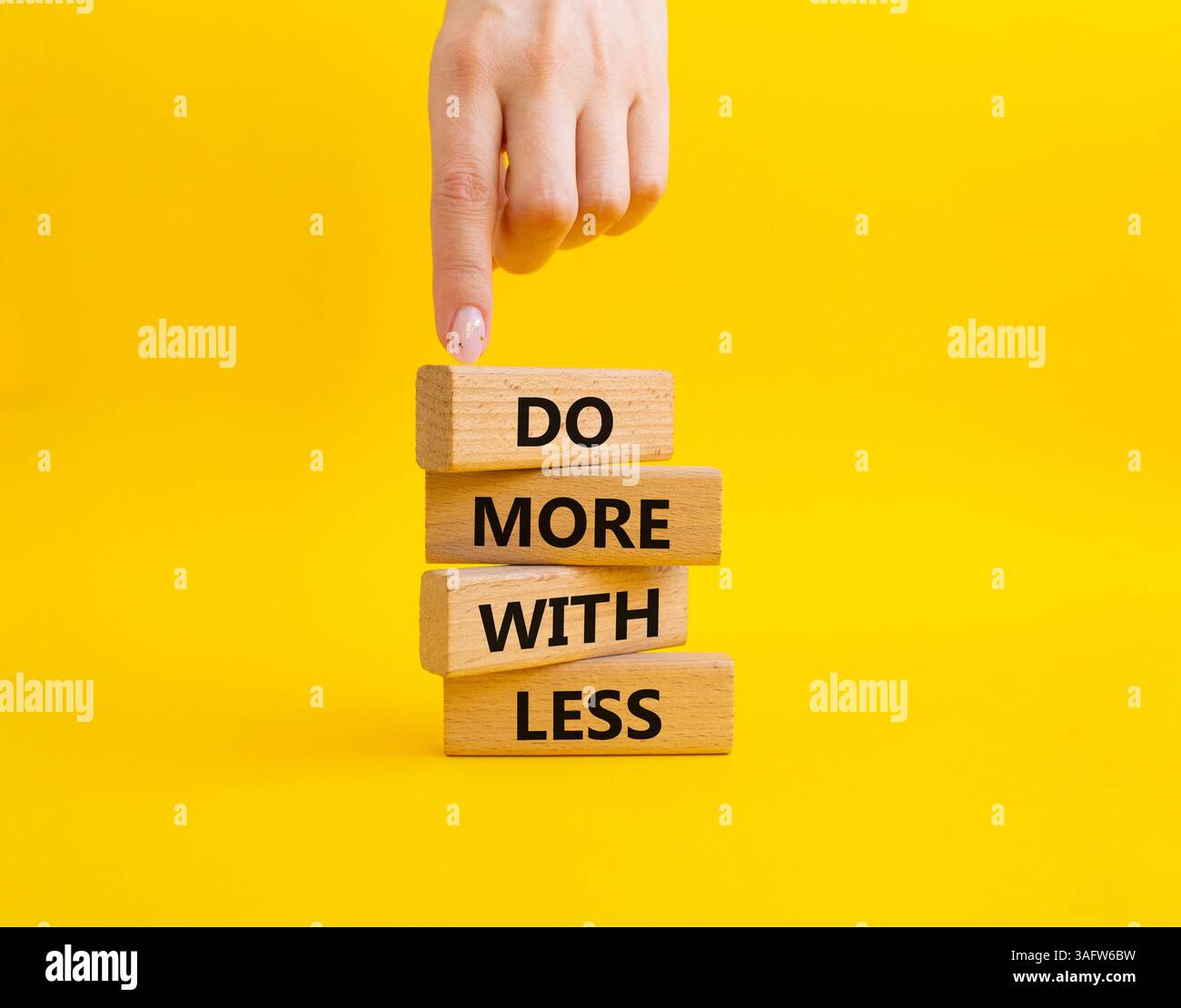 Do more with less symbol. Concept words Do more with less on wooden ...