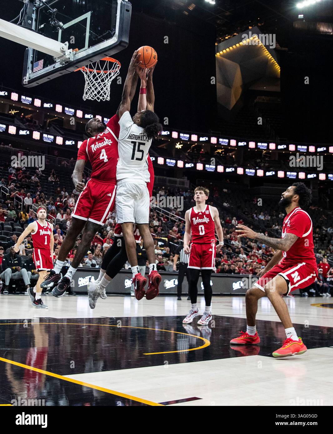 April 06 2025 Las Vegas, NV U.S.A. Nebraska forward Juwan Gary (4) blocks the slam dunk of UCF guard Tyler Hendricks (15)during the NCAA Men's College Basketball Crown Championship game between University of Central Florida Knights and the Nebraska Cornhuskers. Nebraska beat UCF 77-66 at T-Mobile Arena Las Vegas, NV. Thurman James/CSM (Credit Image: © Thurman James/Cal Sport Media) Stock Photo
