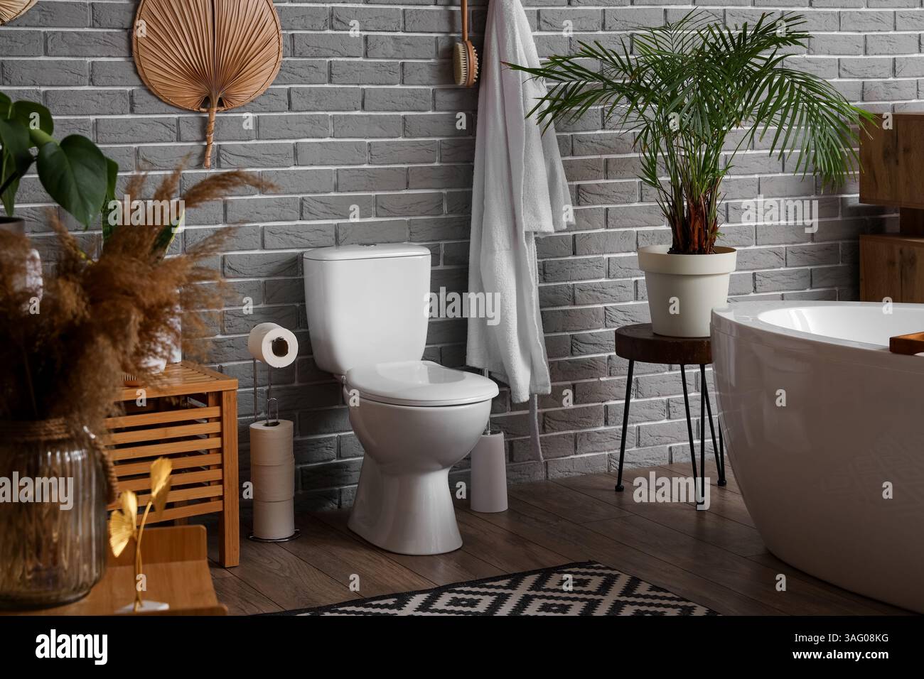 Interior of modern restroom with ceramic toilet bowl Stock Photo - Alamy
