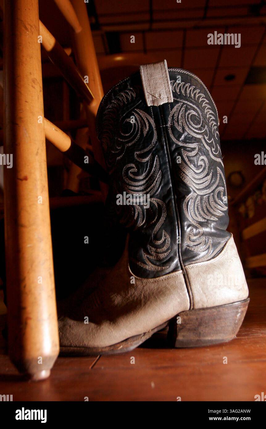 LARGO - Sunday (4/6/2008) - 3) A pair of cowboy boots are parked at the dance floor where dancers traded boots and other shoes for dance shoes to dance the West Coast Swing at Gunslingers Saloon in Largo. The origins of the dance that became known as West Coast Swing can be traced to the Swing Era. During this period many jazz, blues, and western musicians incorporated, or emphasized, the ÒswingÓ in their music. DOUGLAS R. CLIFFORD | Times (Credit Image: St Petersburg Times/ZUMAPRESS.com) Stock Photo