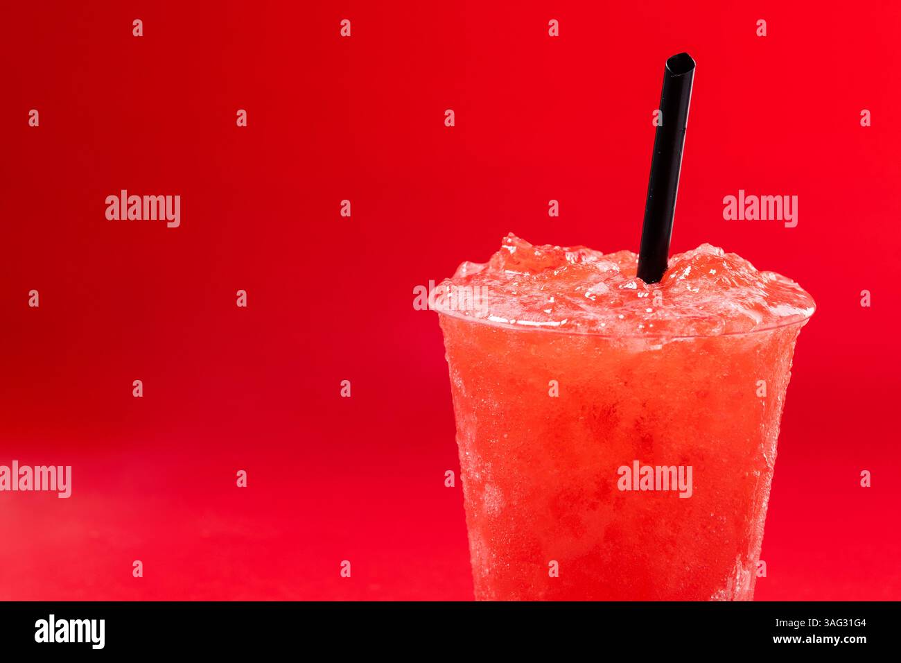 Red strawberry slushie isolated on red background Stock Photo