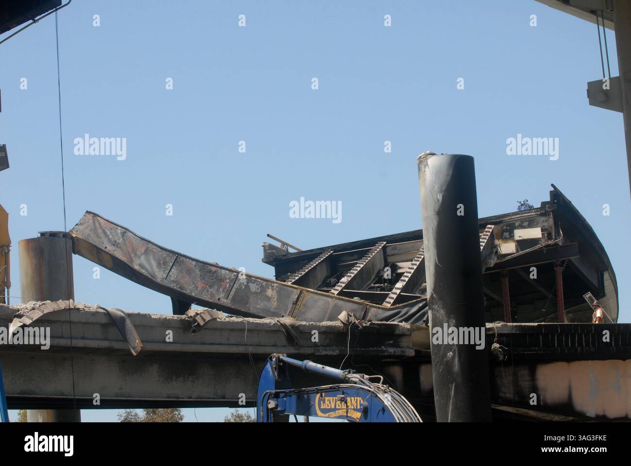 CalTrans workers repair the destroyed ramp, caused by a gasoline tanker ...