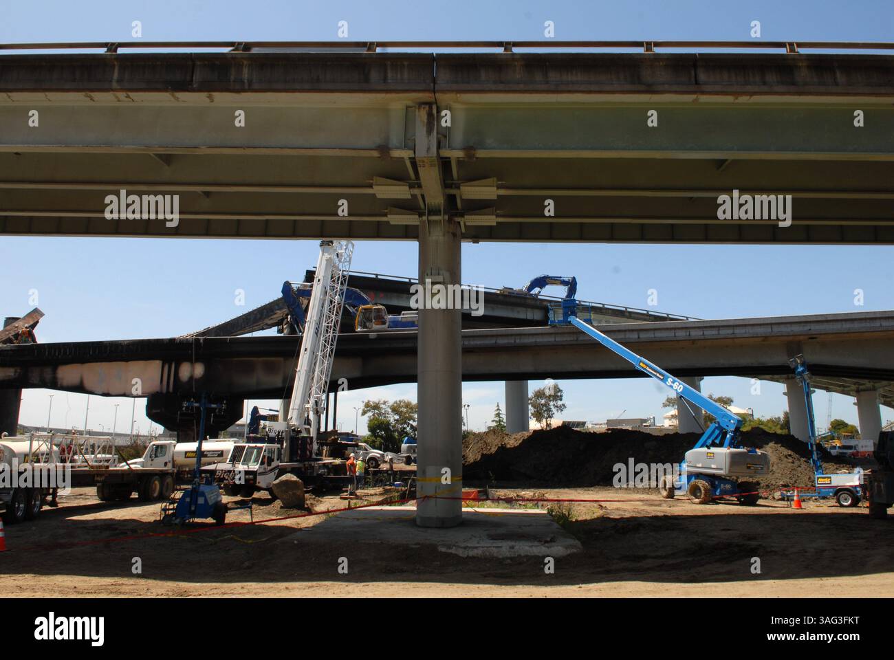 CalTrans workers clean-up the destroyed ramp, caused by a gasoline ...