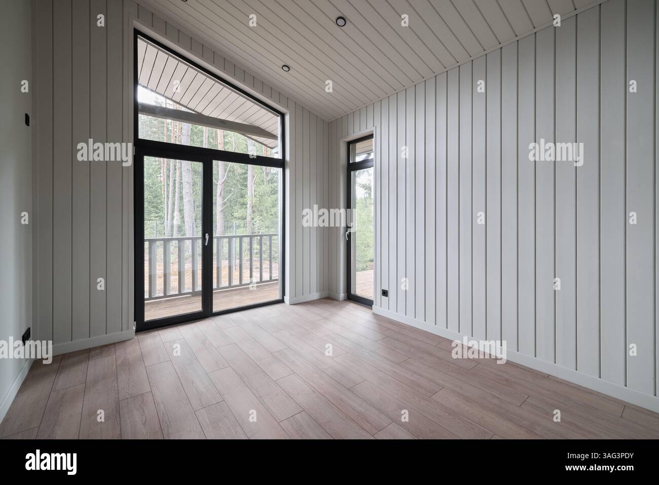 The Modern Interior of an Unfurnished Room featuring Large Windows for ...