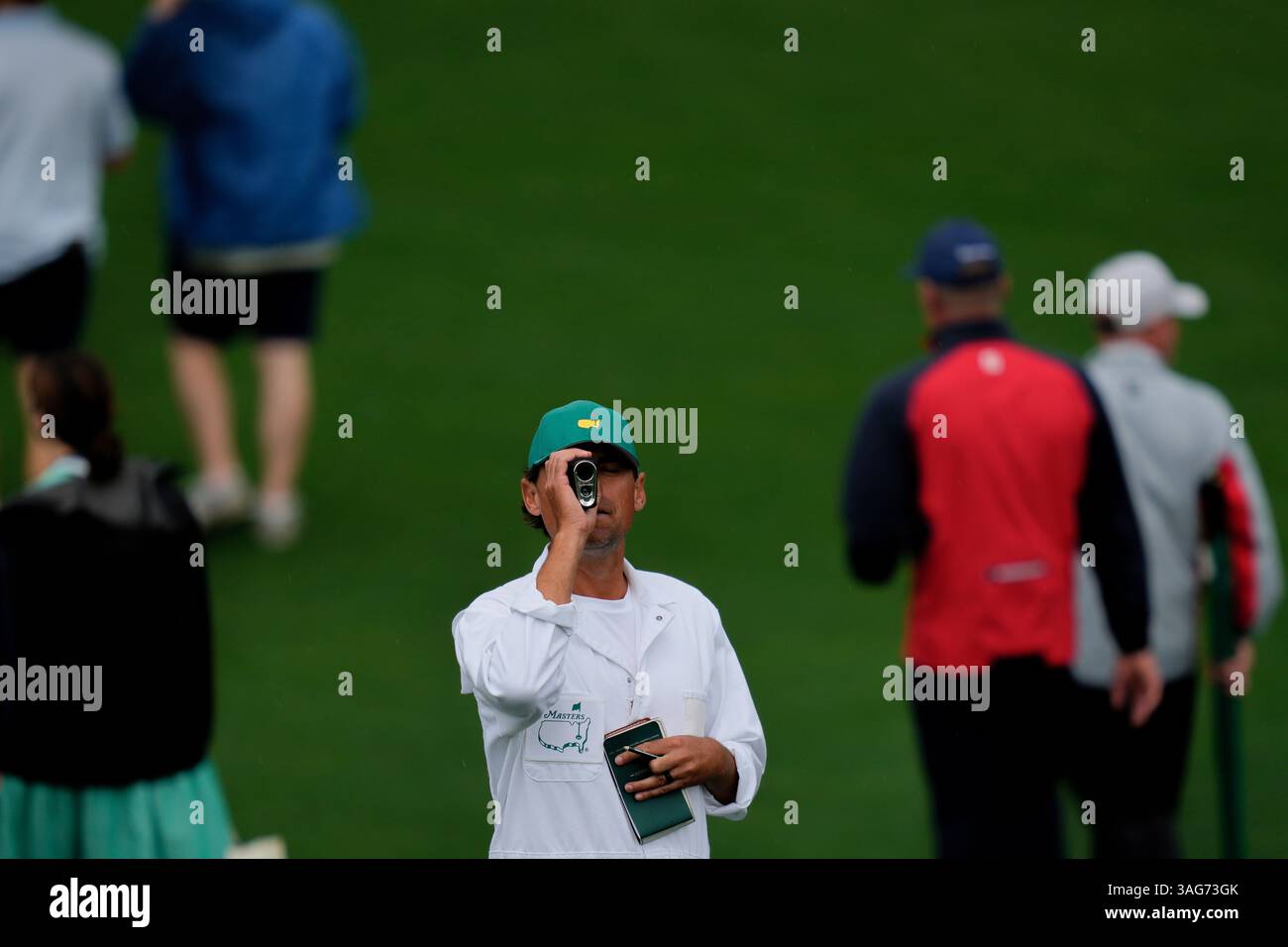 Joel Stock Caddie For Will Zalatoris Uses A Rangefinder Next To The joel-stock-caddie-for-will-zalatoris-uses-a-rangefinder-next-to-the