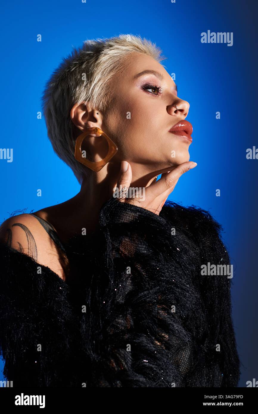 Stylish woman poses elegantly, highlighting her unique fashion sense ...