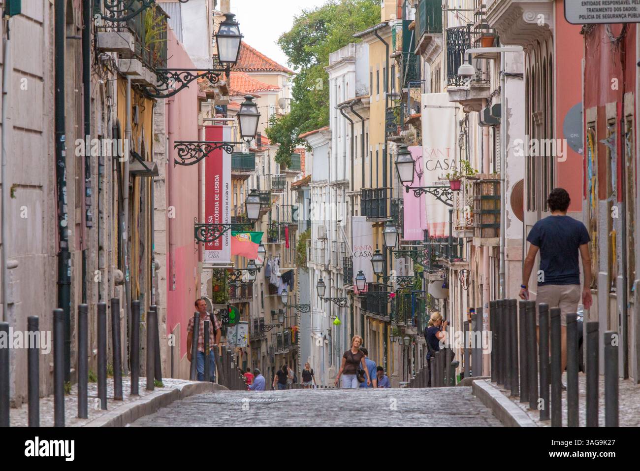 Colorful street in Lisbon’s Bairro Alto with traditional architecture ...