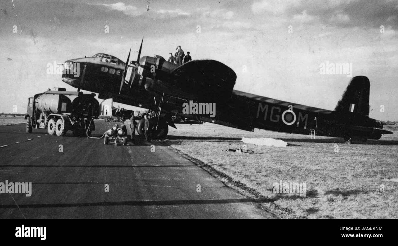 'Stirling' bombers in ***** R.A.F. the 'Stirling' is one of the new high performance bombers used by the R.A.F. it has ***** and carries three times the load of ***** and nine times the load of a *****. F. 3040. Fuel ***** being loaded into a Stirling bomber. December 2, 1941. (Photo by Sport & General Press Agency, Limited). Stock Photo