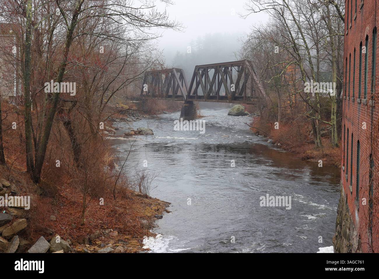 Runs thru downtown Wilton NH. over the Souhegan River. (No other info about this bridge.) The word souhegan comes from Algonquins meaning 'waiting and Stock Photo