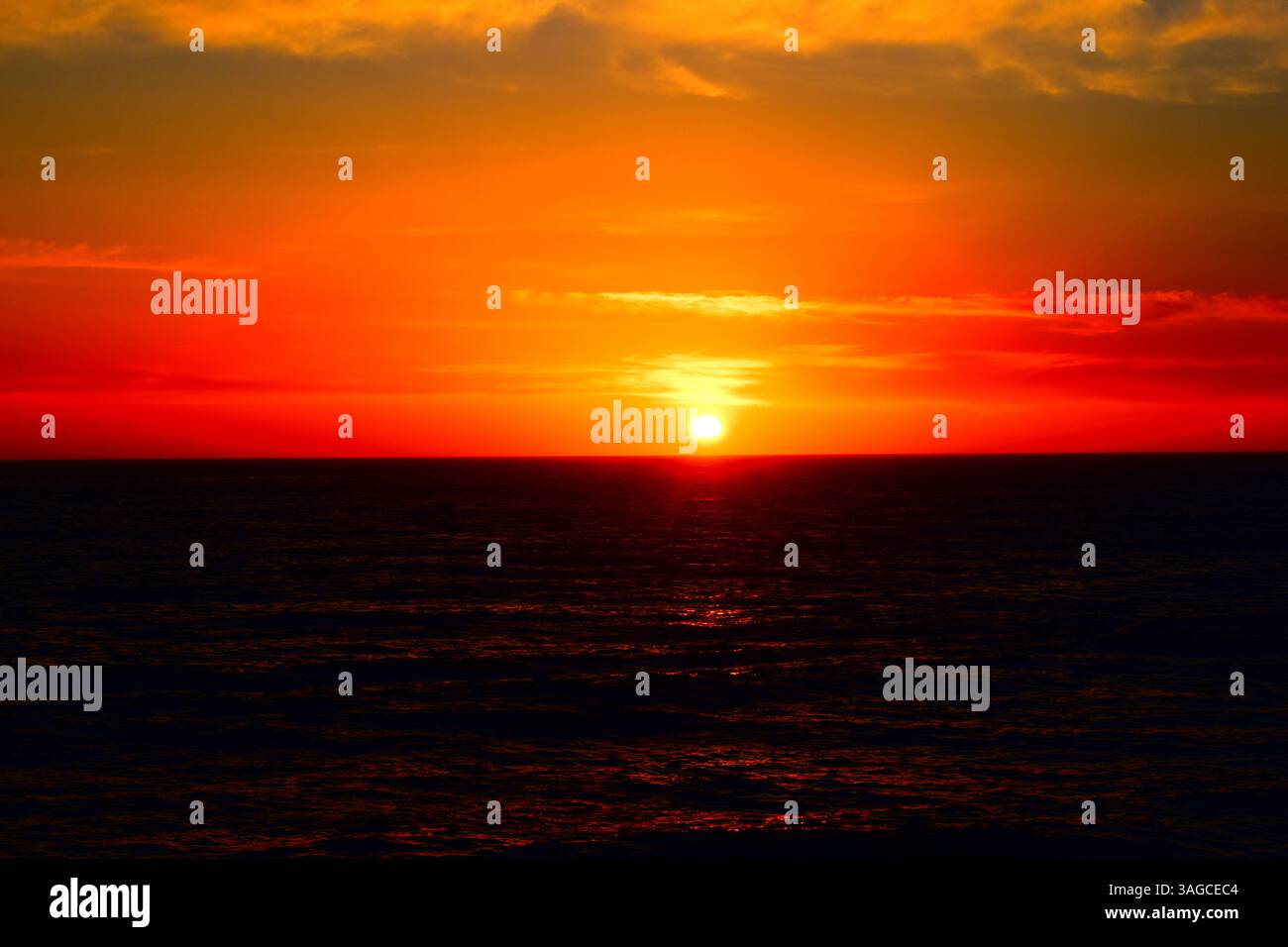 Golden Hour Over the Pacific: A Serene Sunset at Moonstone Beach, Cambria - Stock Image