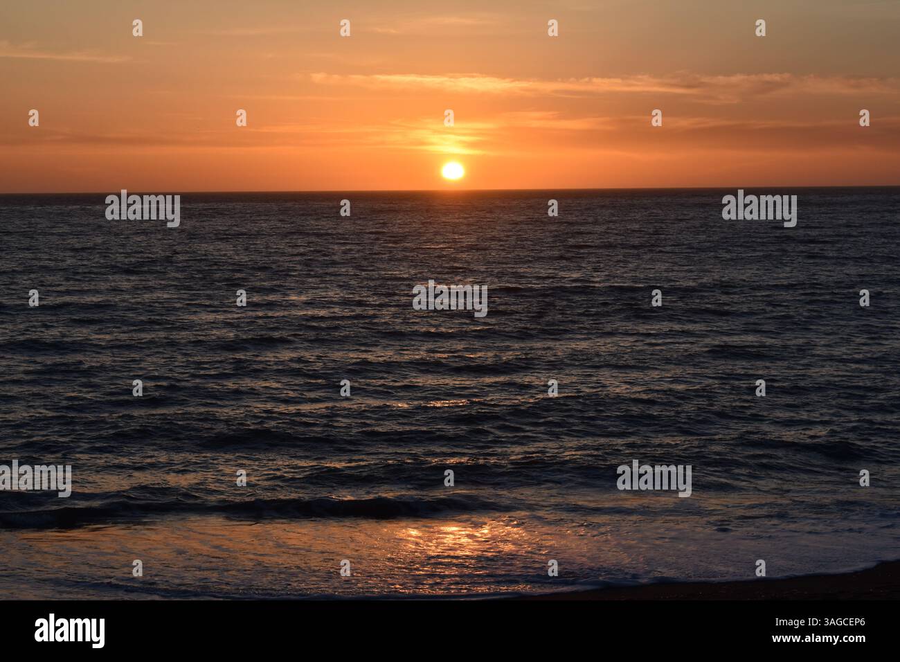 Golden Hour Over the Pacific: A Serene Sunset at Moonstone Beach, Cambria - Stock Image