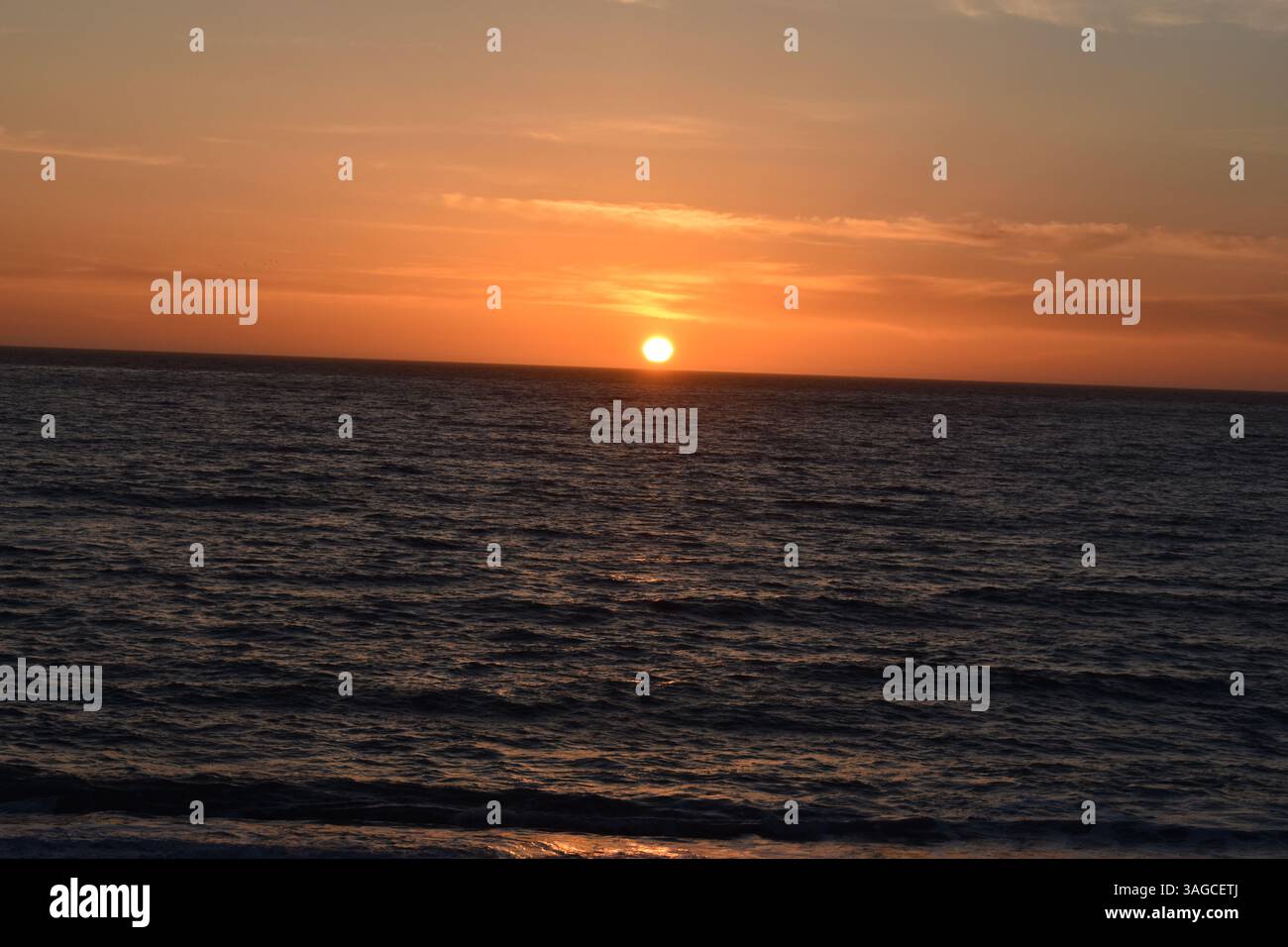 Golden Hour Over the Pacific: A Serene Sunset at Moonstone Beach, Cambria - Stock Image