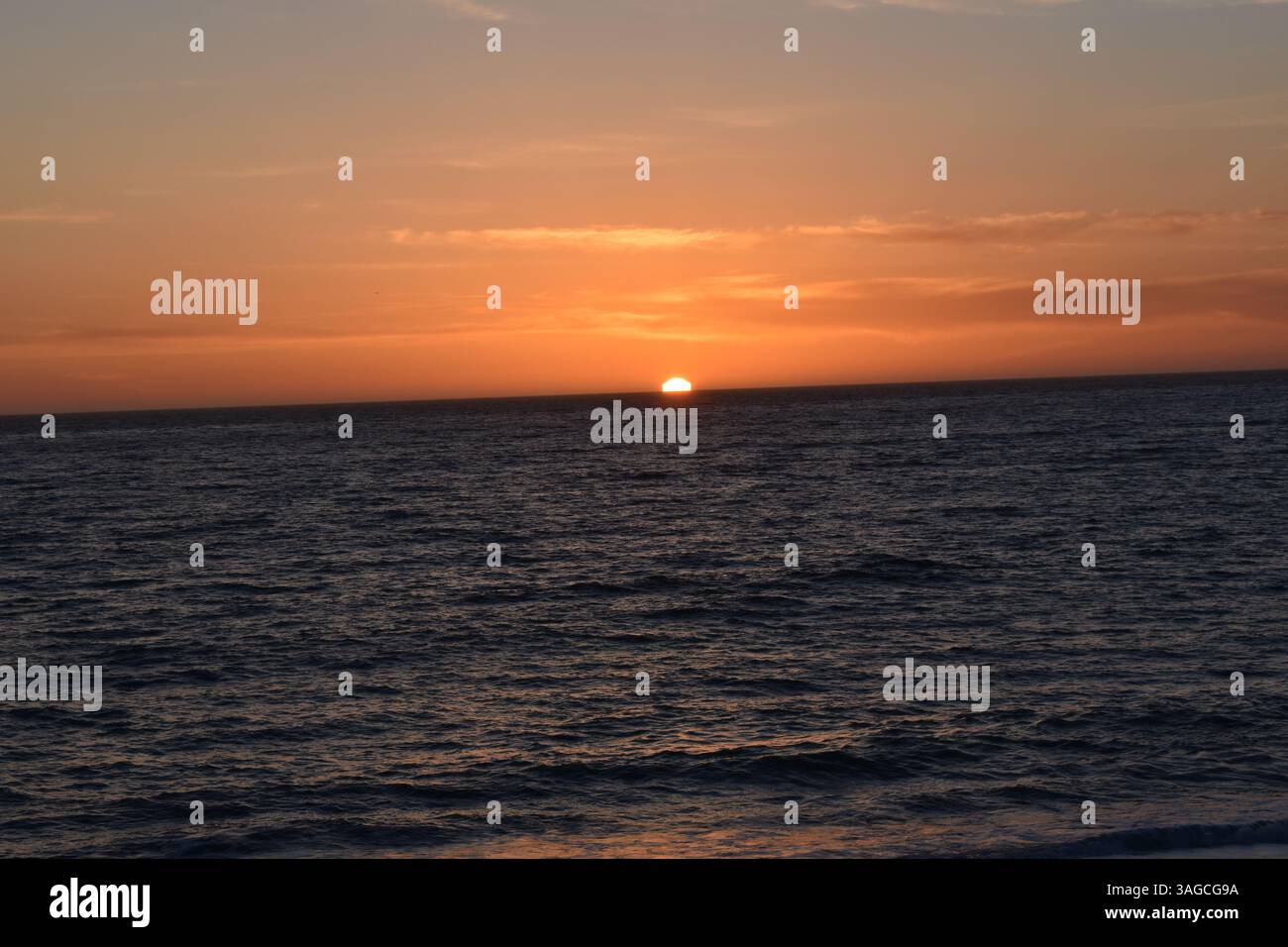 Golden Hour Over the Pacific: A Serene Sunset at Moonstone Beach, Cambria - Stock Image
