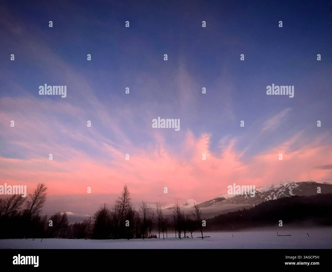 Winter Sunrise over Snowy Landscape and Mountain Range - Smartphone Captured Stock Image