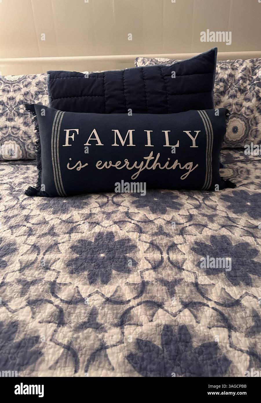 Decorative Pillow with Family Quote on Bed - Smartphone Captured Stock Image