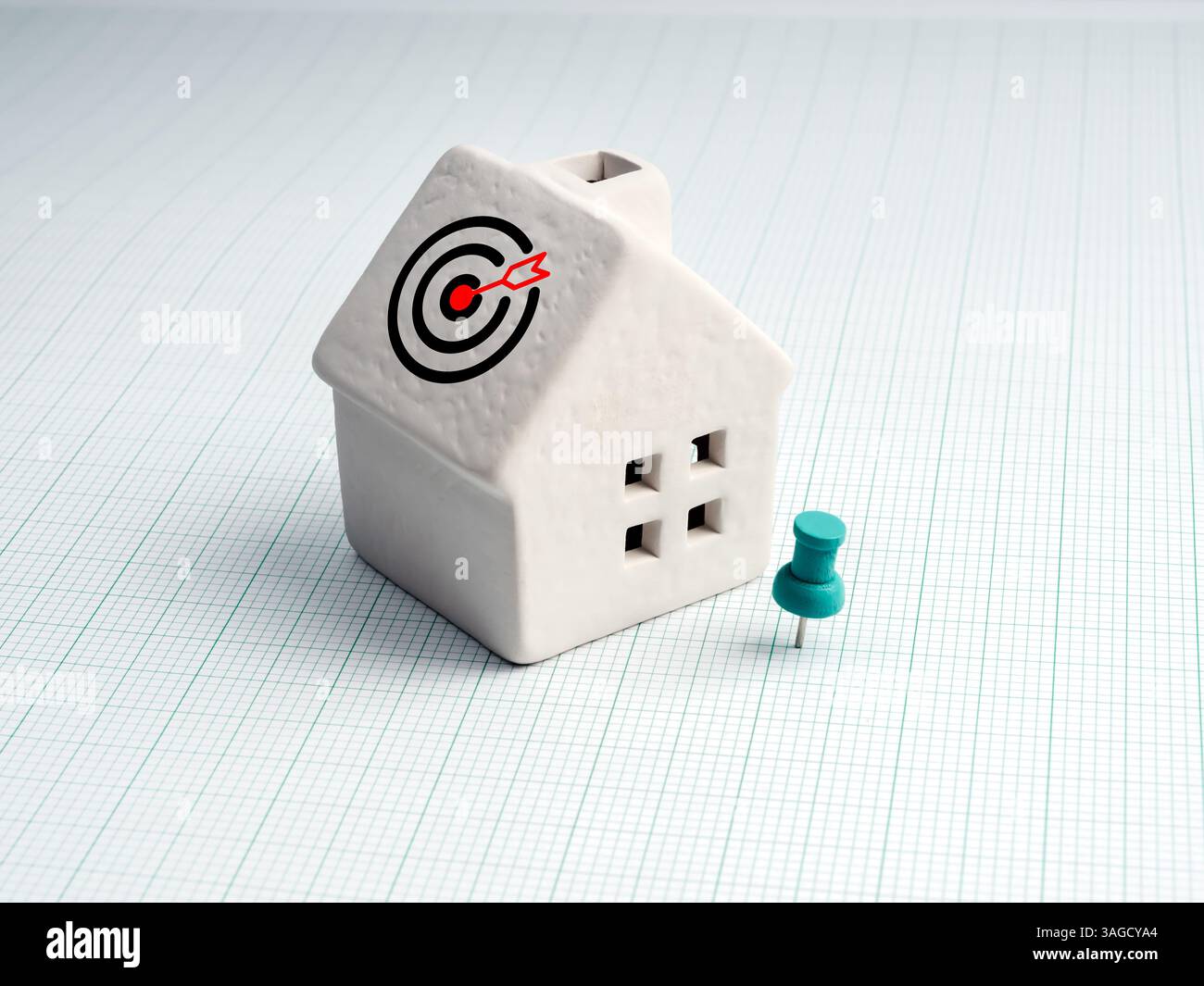 Home and land location, property value, real estate buying and selling market and investment concepts. Target hit, goal icon on white miniature house Stock Photo