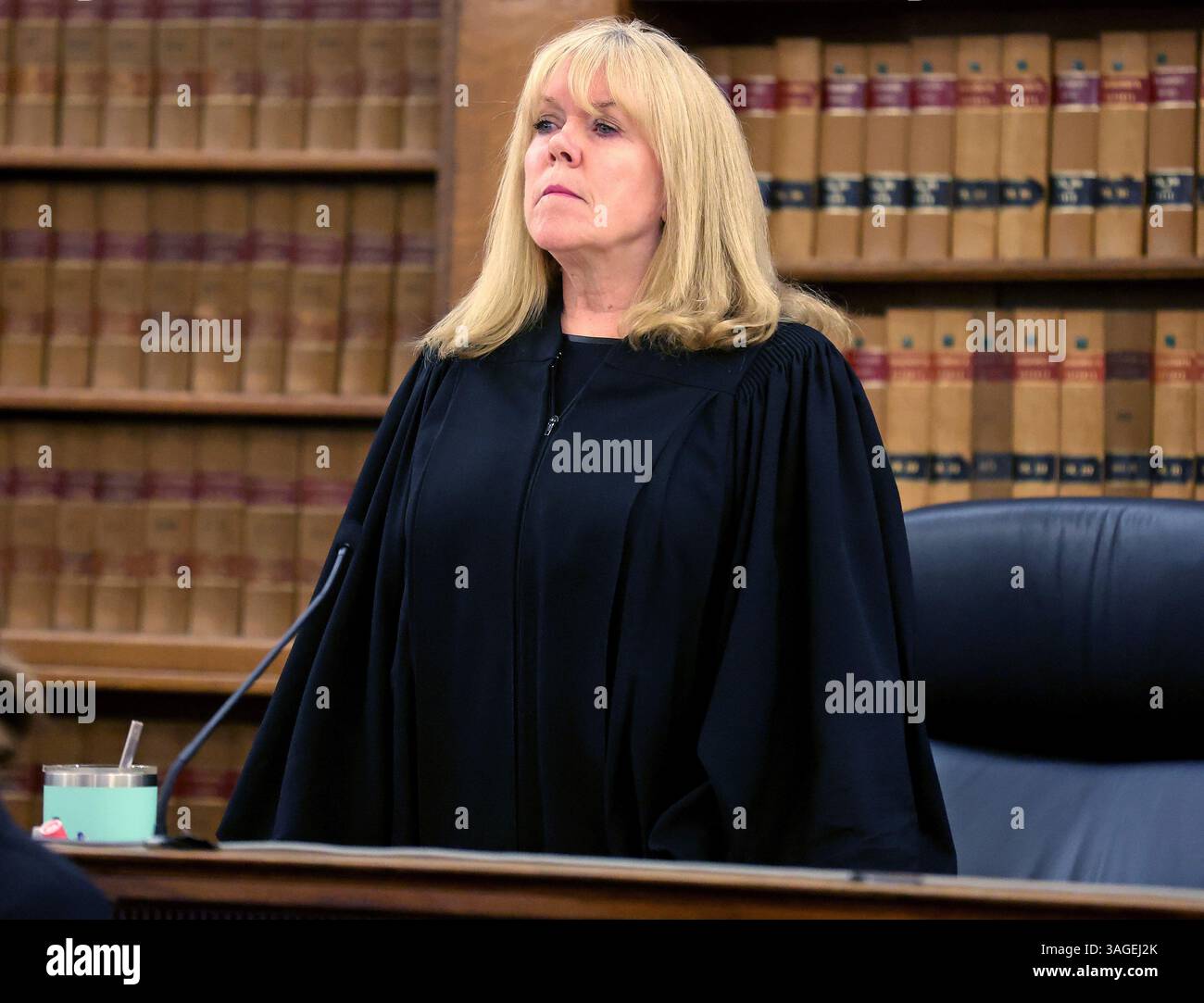 Superior Court Judge Beverly Cannone stands up as jury members enter ...