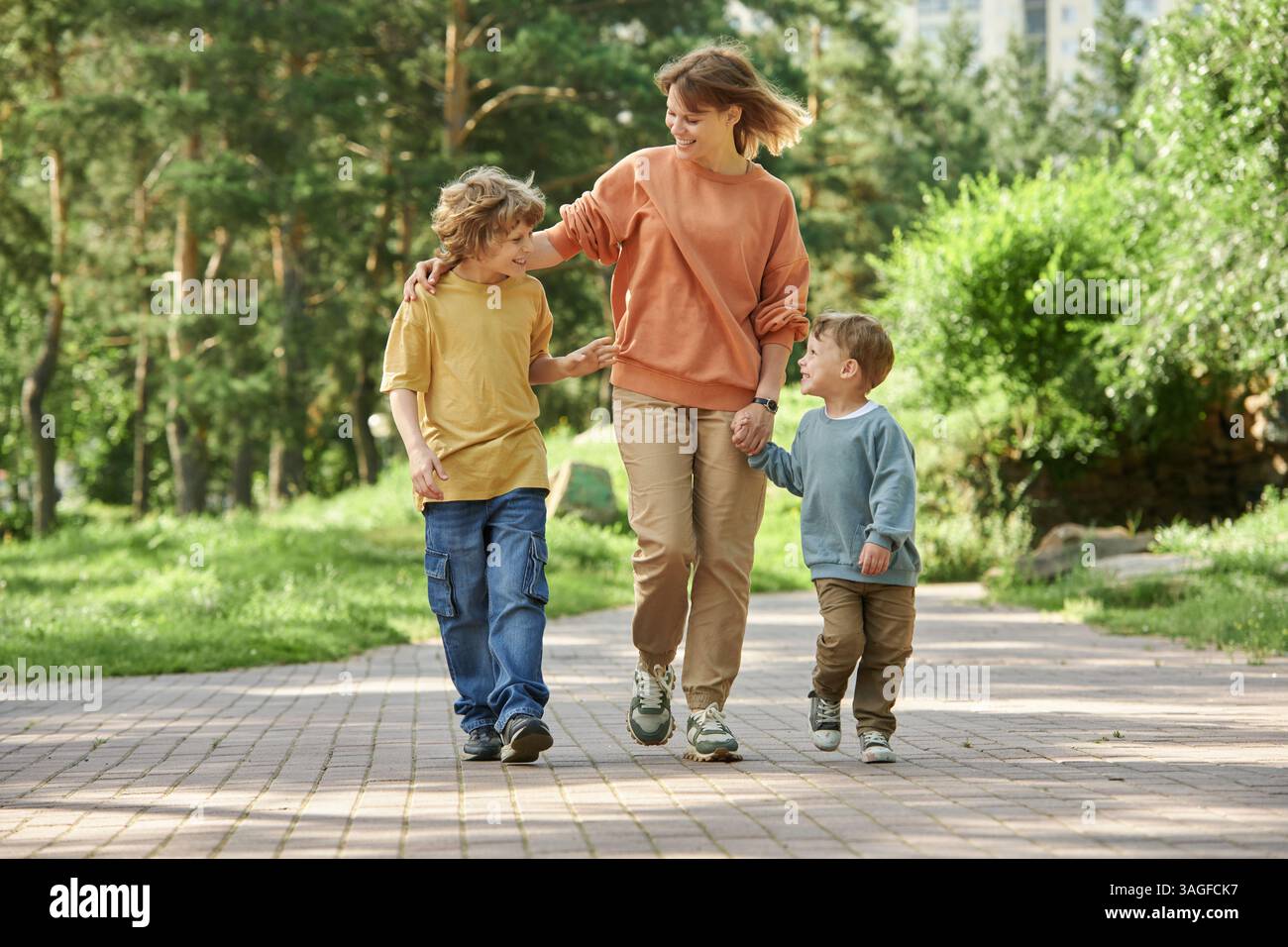 Family holding hands on road hi-res stock photography and images - Alamy