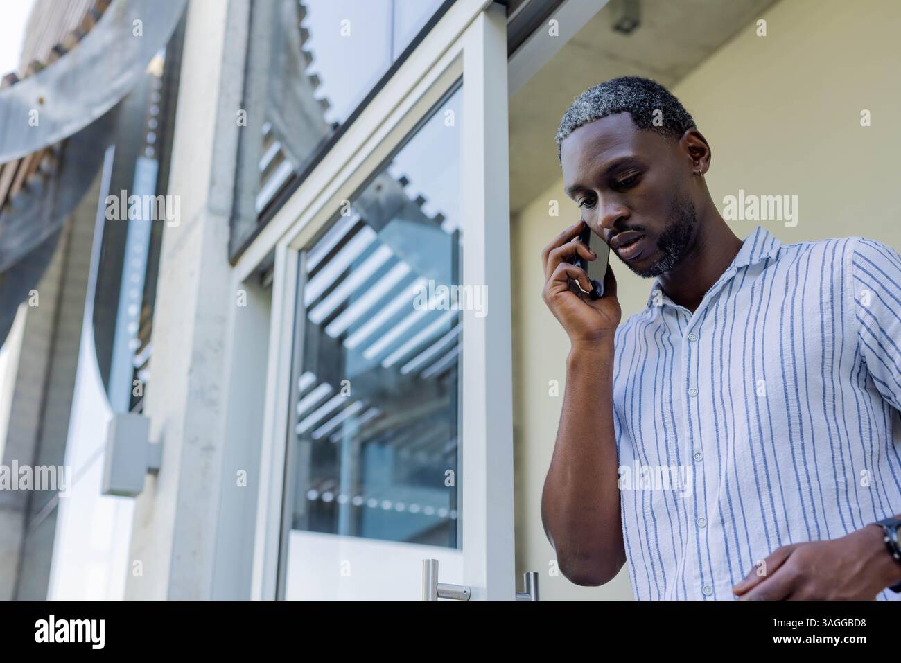 African American African American man talking on smartphone outside ...