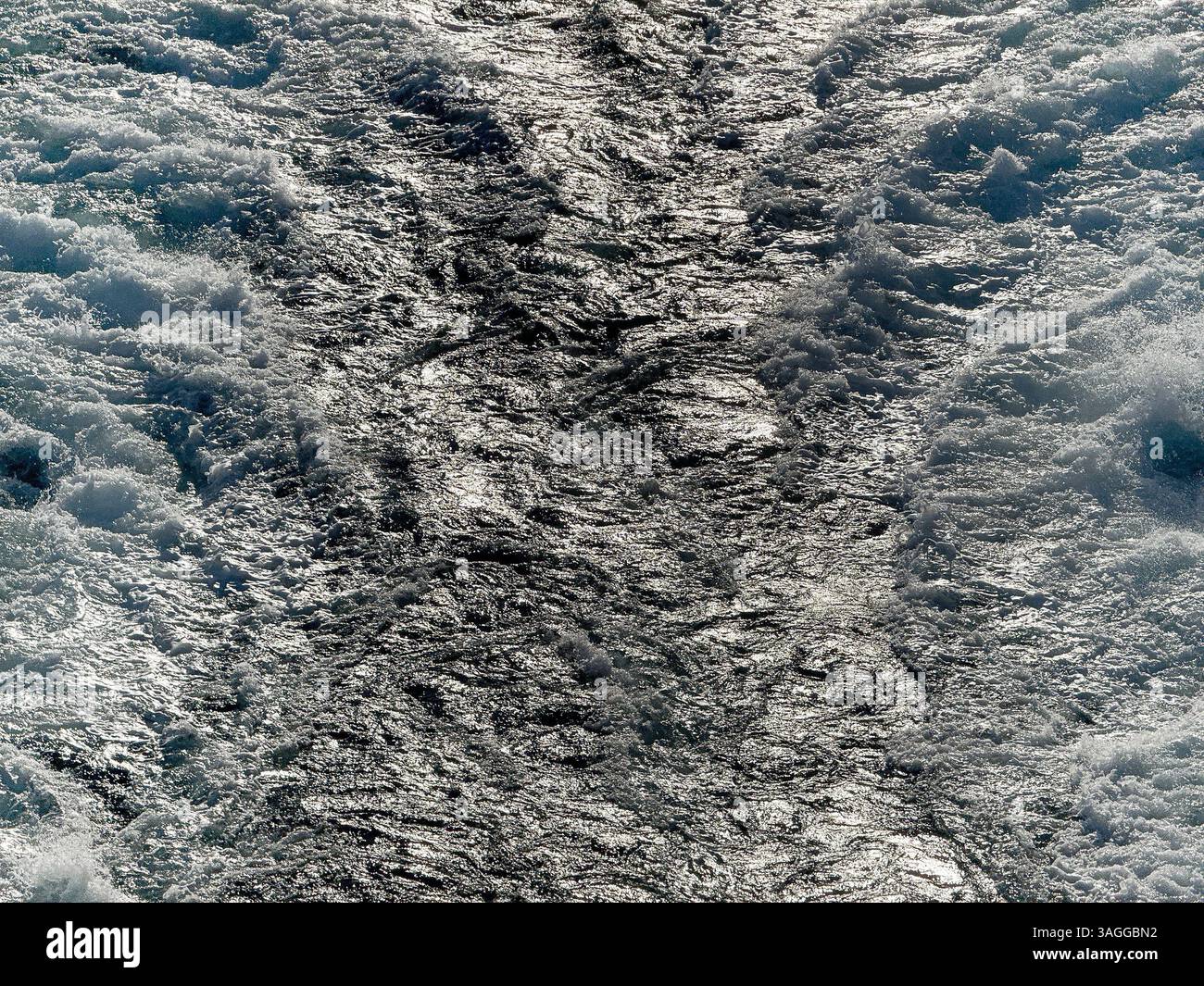 Turbulent waters in the wake of the powerful engines of a cruise ship at sea. Backgrounds. Cruise vacation concept. No people. - Smartphone Captured Stock Image