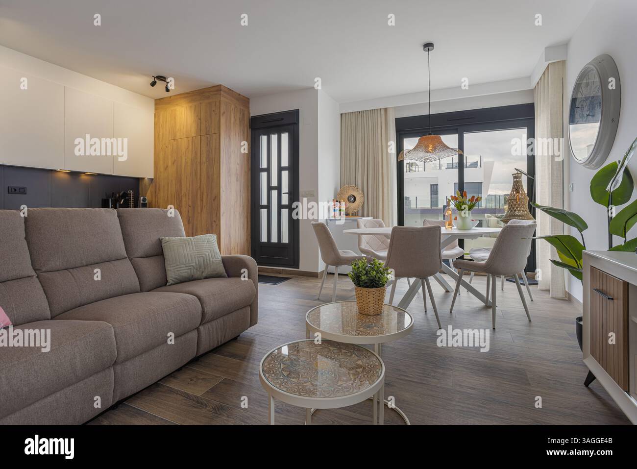 View of a modern apartment's open layout with integrated dining and ...