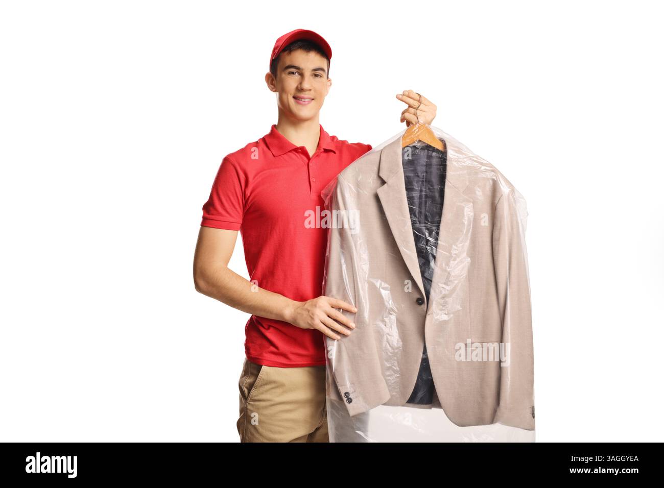 Dry cleaning worker holding a suit isolated on a white background Stock Photo