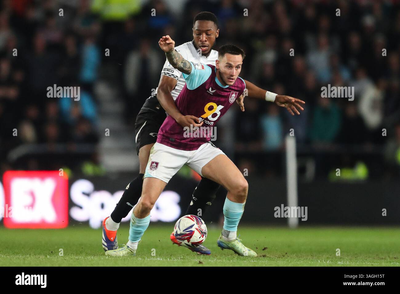 Derby, UK. 08th Apr, 2025. Josh Brownhill of Burnley holds off Ebou ...