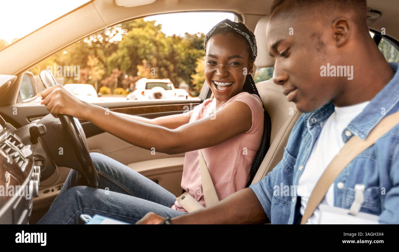 Black man instructor examinating happy lady student Stock Photo