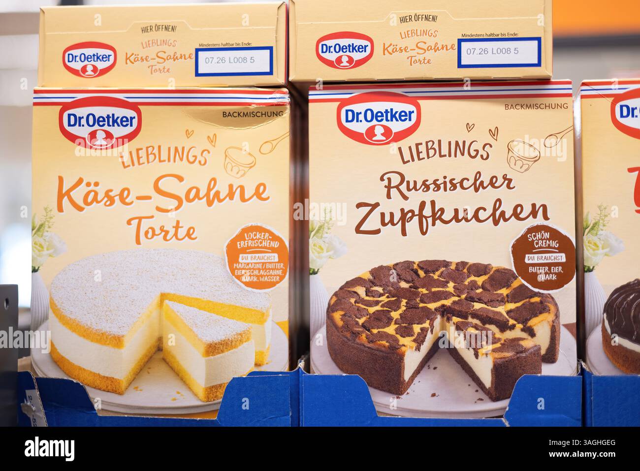 An appealing assortment of Dr. Oetker cake mixes, featuring Kaese-Sahne Torte and Russischer Zupfkuchen for baking enthusiasts. - FRANKFURT, GERMANY - Stock Photo