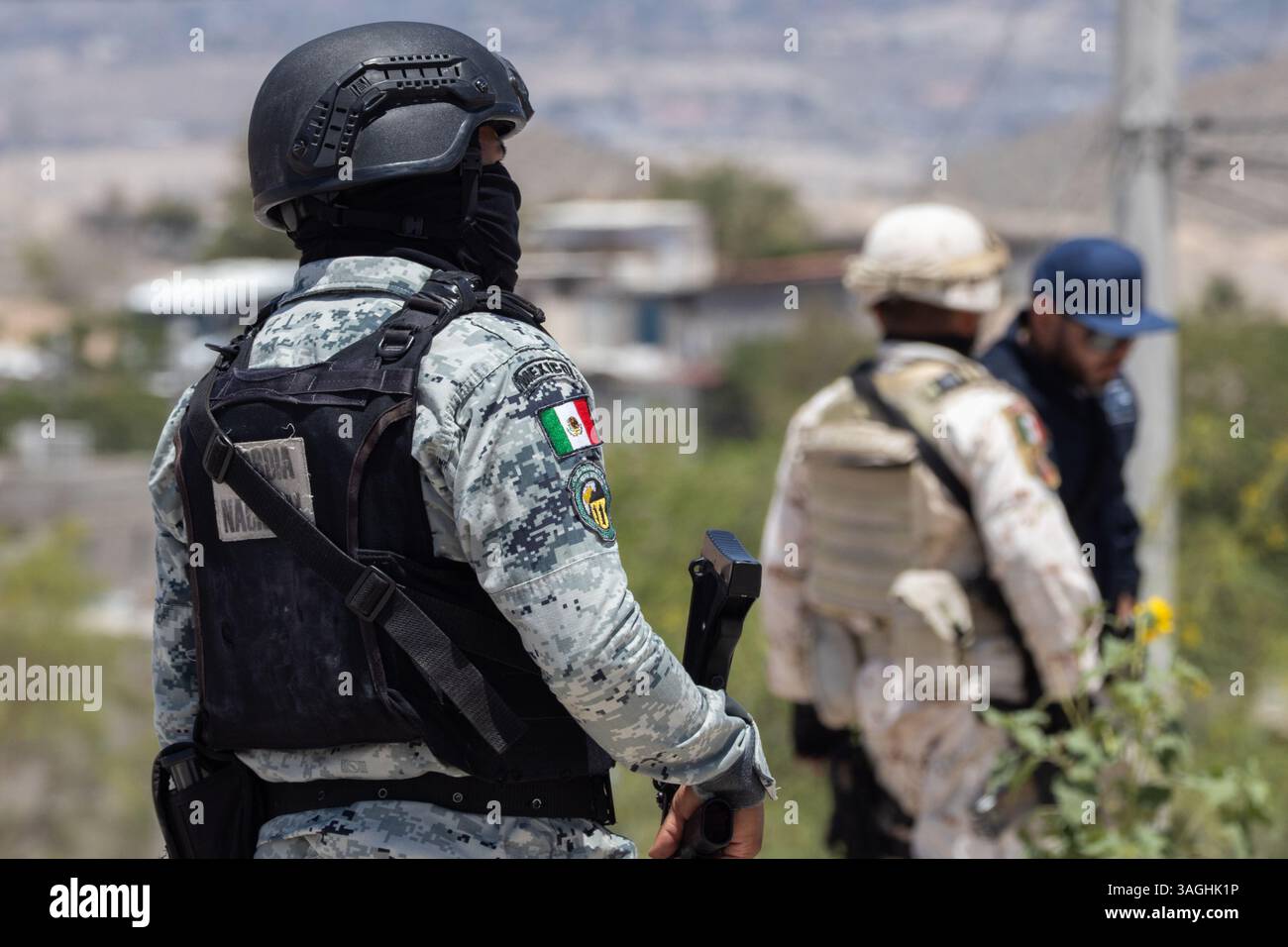 Mexican military and National Guard patrol near the US border wall in ...