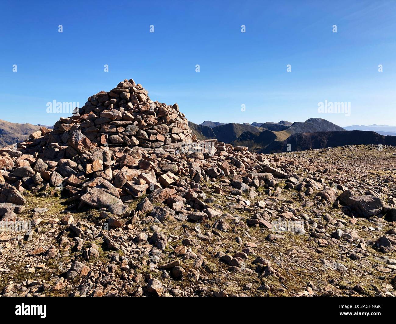 Summit cairn of munro Mullach nan Coirean, The Mamores mountain range, near Fort William, Scotland - Smartphone Captured Stock Image