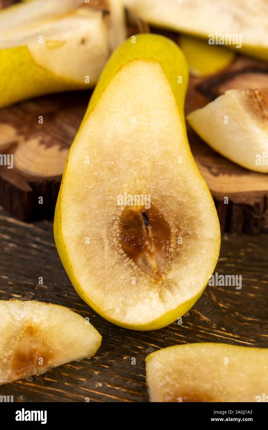 ripe green pear, the pulp inside of which has begun to rot, part of the ...