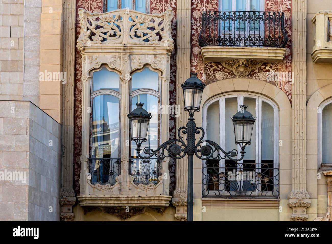 Spanish architecture, windows, balconies, and street lamps Stock Photo ...
