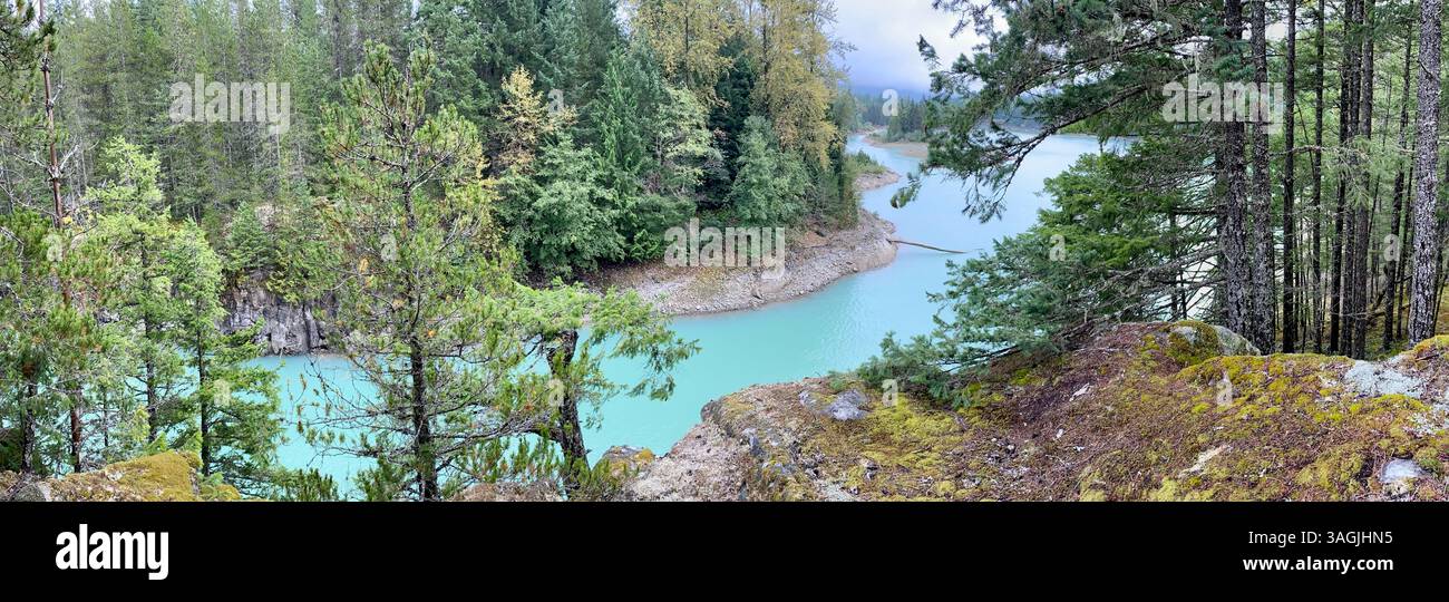 Turquoise River Winding Through Forested Cliffs - Smartphone Captured Stock Image
