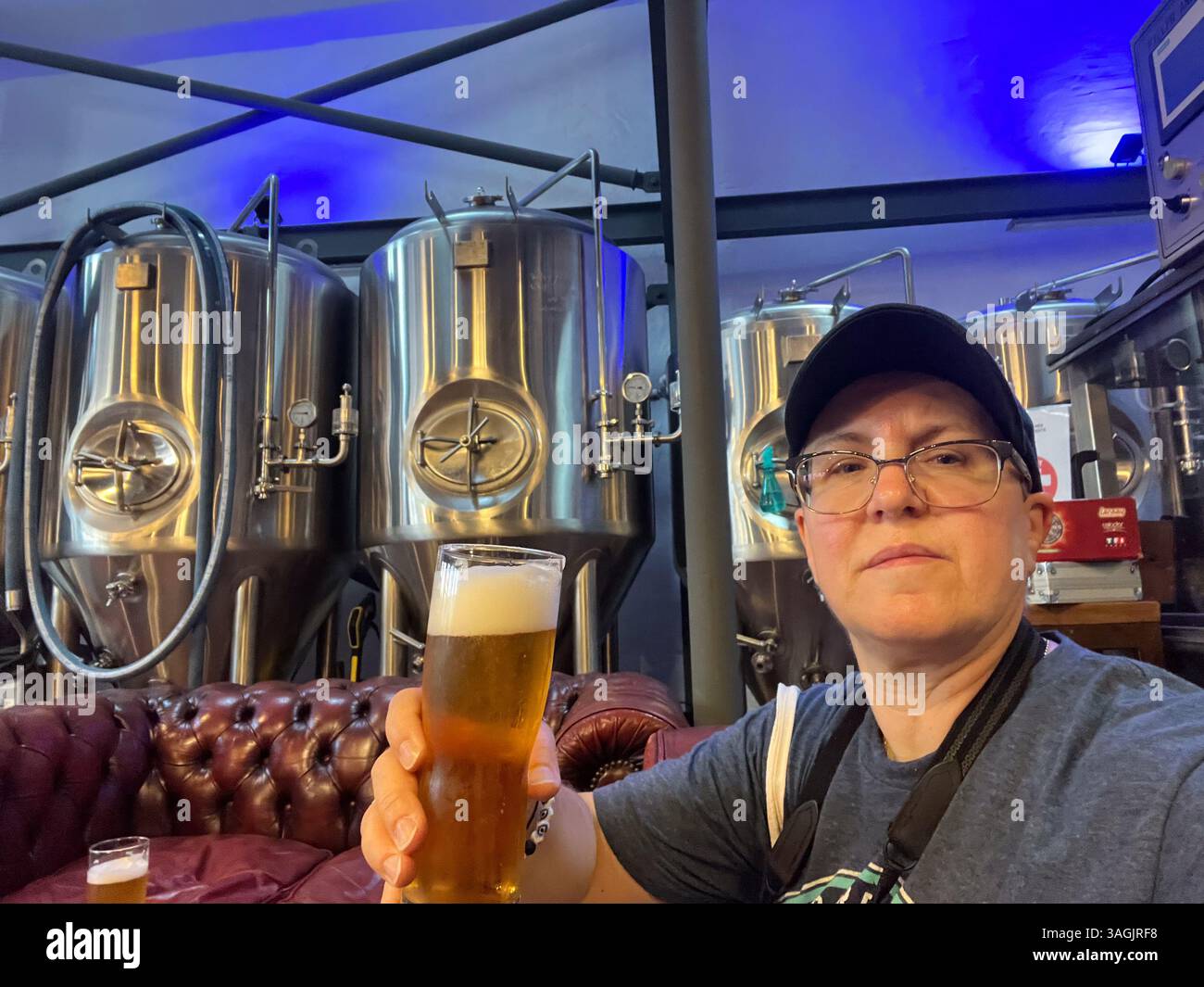 Golfe-Juan, France - 09-23-2022 : woman having a beer in craft brewery in the French Riviera - Smartphone Captured Stock Image