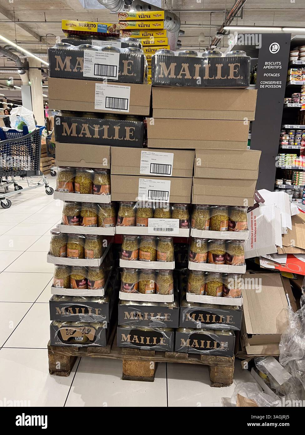 Antibes, France - 09-27-2022: palette of mustard jars in supermarket in France - Smartphone Captured Stock Image