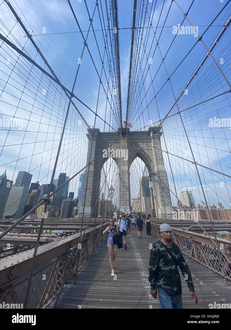 New York, NY, USA - 09-03-2022 : Brooklyn Bridge in New York City on blue sky day - Smartphone Captured Stock Image