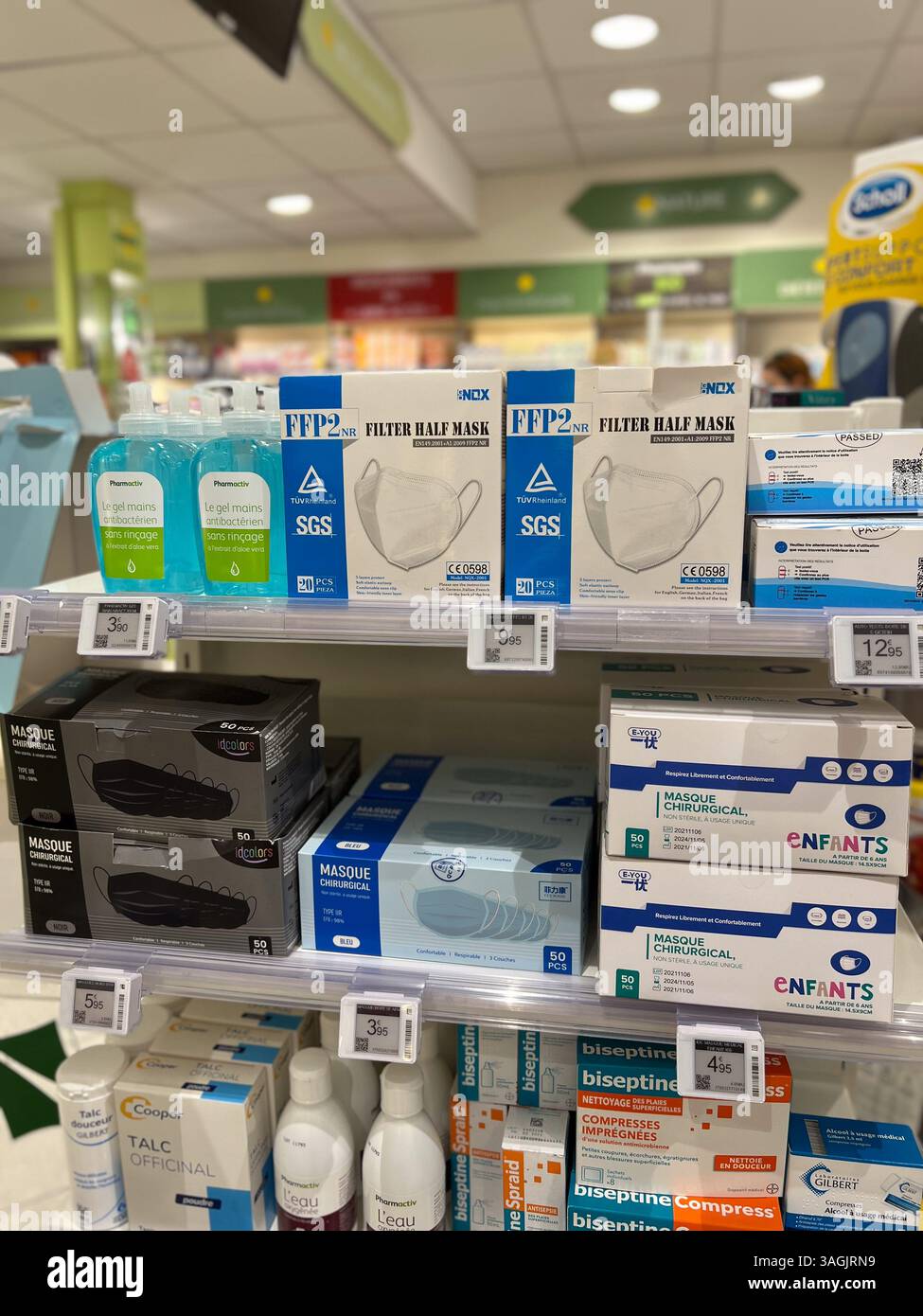 Golfe-Juan, France - 09-10-2022 : various face masks on display on shelves in a pharmacy in France - Smartphone Captured Stock Image