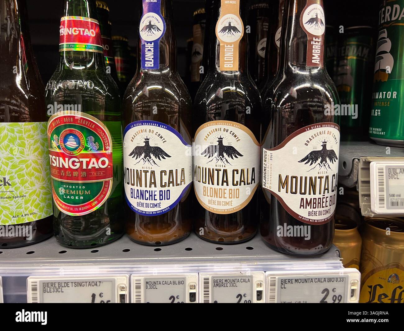 Golfe-Juan, France - 09-10-2022 : various semi-craft beer bottles on shelves in liquor store in France - Smartphone Captured Stock Image