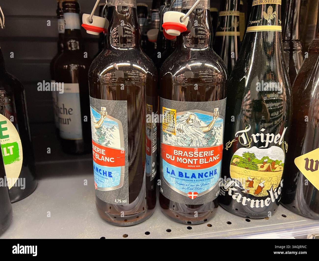 Golfe-Juan, France - 09-10-2022 : various semi-craft beer bottles on shelves in liquor store in France - Smartphone Captured Stock Image