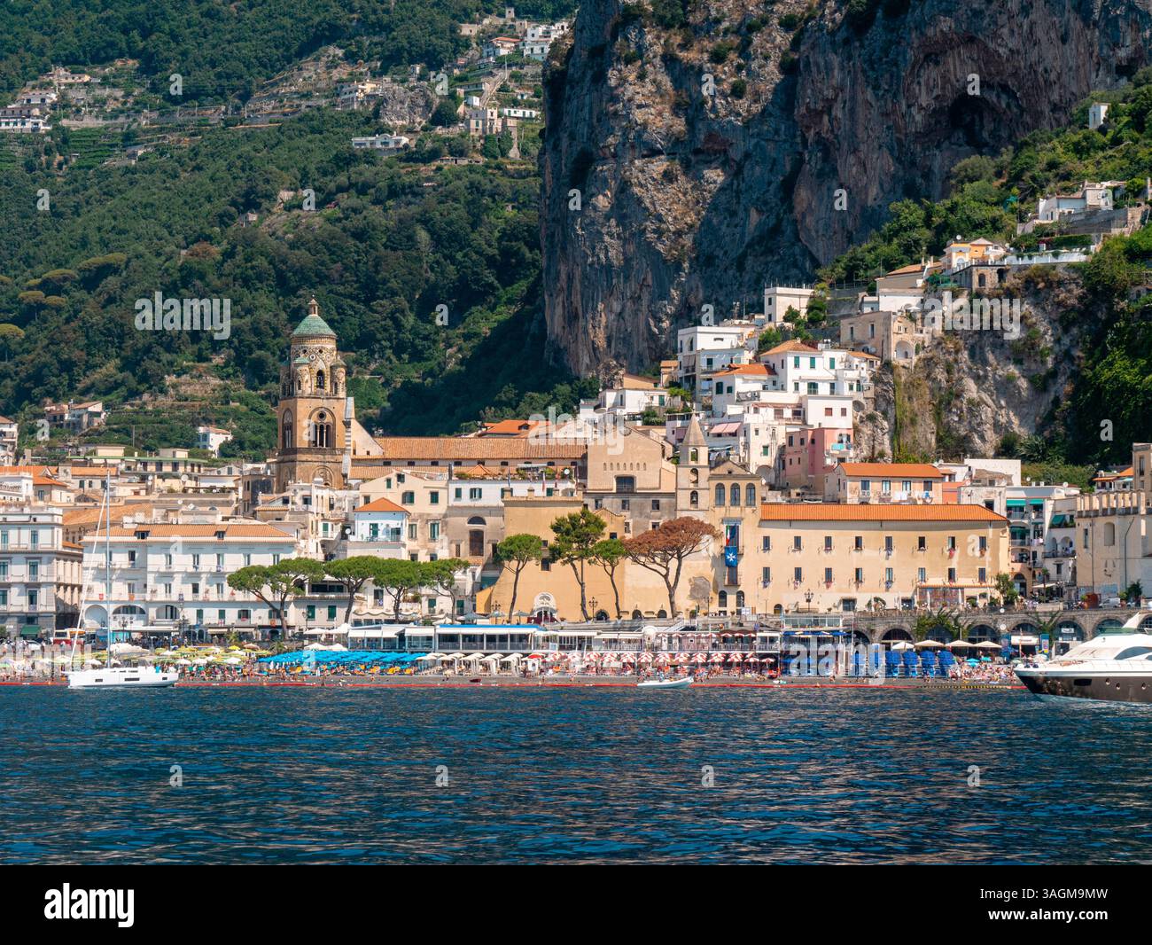 Historic Amalfi Town with Cathedral Bell Tower and Crowded Beach during ...