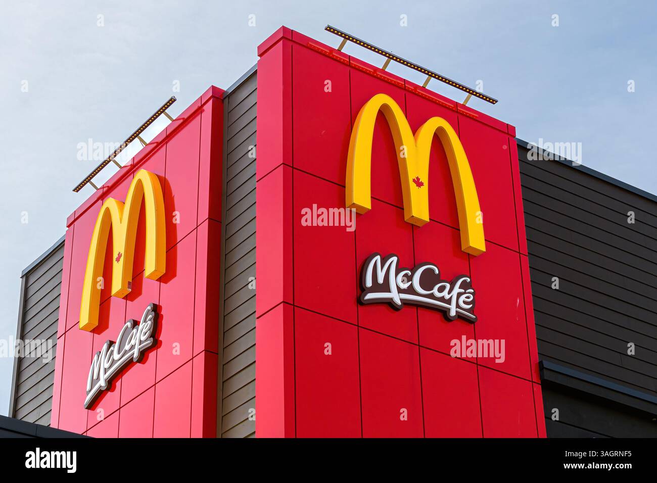 Logo of McDonald’s and McCafé on the upper section of a building Stock ...