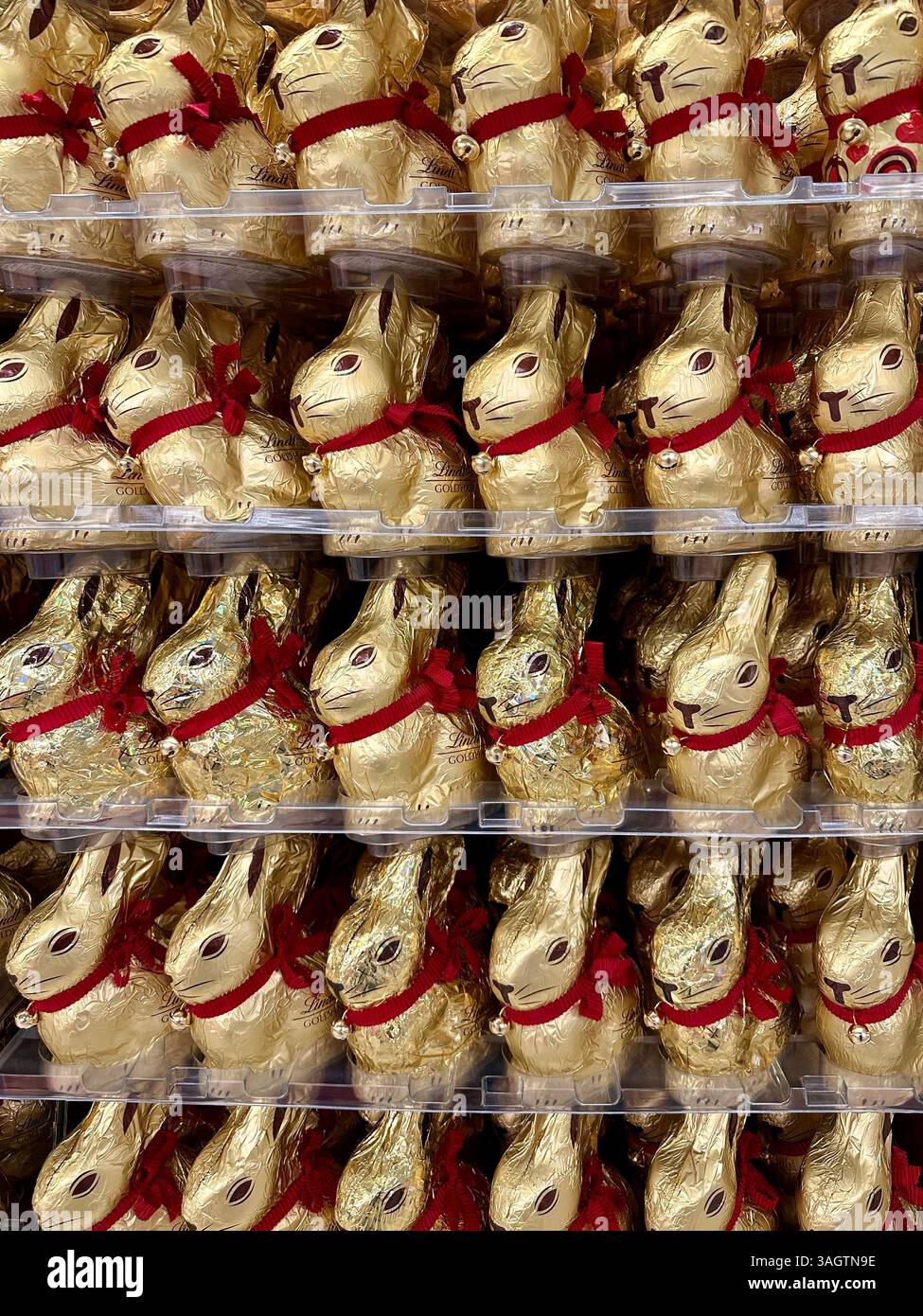 Lindt gold easter bunnies on display in a supermarket - Smartphone Captured Stock Image